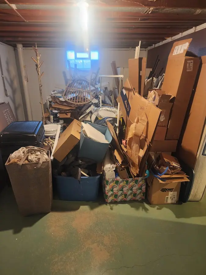 Roll-off dumpster container at job site for 2 Yard Dumpster Rental in Whitehall