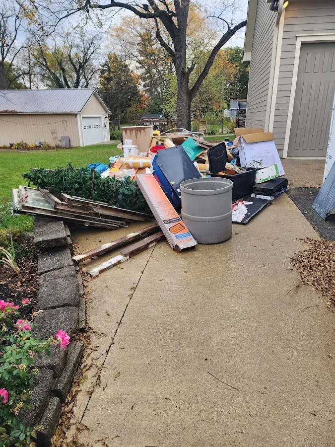 Dumpster being loaded with debris for Commercial Dumpster Rental in Whitehall